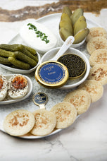 Royal Kaluga Caviar served with blinis, crème fraîche and condiments